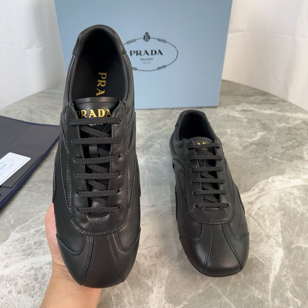 PRADA 25S MONTECARLO ANTIQUED SNEAKERS IN BLACK NAPPA LEATHER