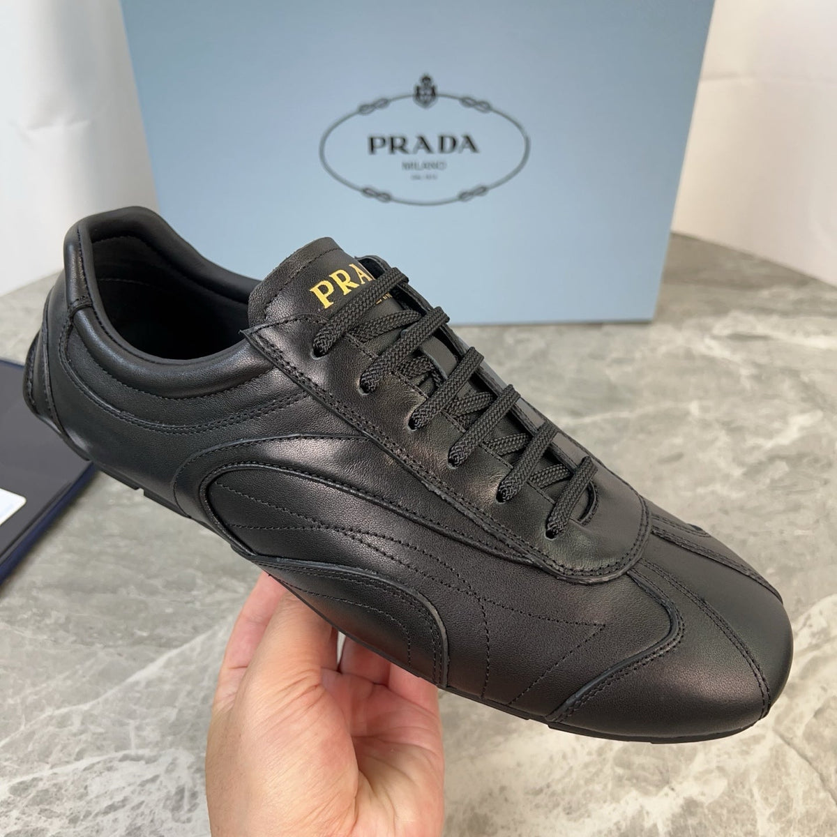 PRADA 25S MONTECARLO ANTIQUED SNEAKERS IN BLACK NAPPA LEATHER